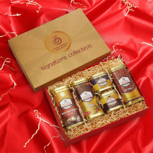 Earthen Wellness custom gift boxes with assorted Ayurvedic oils, powders, and coffee
